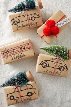 three wooden stamps with christmas trees and cars on them, one has a rubber stamp that says