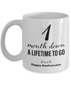 a white coffee mug with the words 1 month down, a life time to go