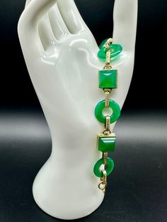 "Fabulous Rare 1930s Art Deco 14k Gold Chrysoprase Lifesaver Sugarloaf Bracelet  Sugarloaf Cabachons connect to lifesaver chrysoprase gems via 14k gold links. Our tester indicated 18k but we are pricing per the consignment client at 14k. All stones in very nice condition. Slight wear scratches from age. Spring ring close works well.  Measures 7 1/2\" Truly wonderful vintage piece to add to your jewelry collection. Weight: 24.1g Ref # CF" Retro Green Bracelet Jewelry, Luxury Green Rectangular Bracelets, Green Art Deco Bracelets As A Gift, Green Art Deco Bracelets For Gift, Green Art Deco Bracelets As Gift, Green Art Deco Bracelet As Gift, Mid-century Green Collectible Jewelry, Green Art Deco Bracelet, Art Deco Green Bracelet For Formal Occasions