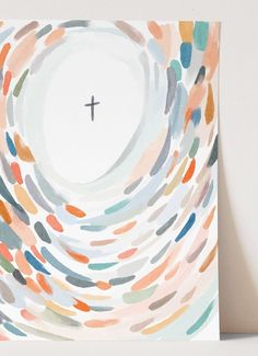 a cross is in the center of a painting with multicolored circles on it