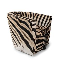 a zebra print chair sitting on top of a white floor