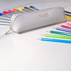 Our stylishly practical pencil case is a must have for any stationery fan. It makes a great gift for that special teacher, or why not treat yourself - You won't want to keep your pens in anything else. Give it a personal touch by adding your initials or name in the colour of your choice. Measuring approximately 23cm x 6cm x 5cm, it's lightweight and stylish. Choose from classic black, pale grey or soft pink, with a matching coloured fabric lining and gold detailing. This comes delivered in a branded bag, but if you require a gift box add 'gift wrapping' at checkout and it will arrive in a box with recipient's first initial attached to satin ribbon. Interested in seeing our other fabulous products? Click here: www.etsy.com/shop/aflondonshop Shipping: Ready to ship in 5 - 10 business days. I Personalised Pencil Case, Use Of Capital Letters, Personalized Pencil Case, Personalized Stationary, Personalized Pencils, Stationary Gifts, Christmas Post, Pen Gift, She & Him