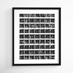 a black and white photo hanging on the wall