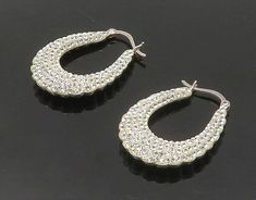 "925 Sterling Silver - Cubic Zirconia Encrusted Fluted Hoop Earrings - EG8929  925 Sterling Silver - Cubic Zirconia Encrusted Fluted Hoop Earrings - EG8929  Jewelry Type:         Earrings   Metal Type:            925 Silver   Metal Size:             1.25\"  Stone Type:            Cubic Zirconia   Condition:              N/A  Jewelry Weight:     7.9 Grams  PLEASE NOTE: THIS ITEM IS PRE-OWNED. ALTHOUGH MOST ITEMS ARE IN VERY GOOD CONDITION, SOME MAY NEED CLEANING AND/OR MINOR REPAIRS. WE MAKE A VERY STRONG EFFORT TO UPLOAD CLEAR PICTURES. PLEASE INSPECT ALL PICTURES AND ASK ALL QUESTIONS YOU MAY HAVE PRIOR TO MAKING A PURCHASE. NOT ALL STONES ARE GENUINE, SOME ARE ENHANCED OR CREATED." Silver Diamond Hoop Earrings For Party, Silver Small Hoop Earrings With Sparkling Stones, Elegant Small Hoop Silver Crystal Earrings, Elegant Silver Small Hoop Crystal Earrings, Silver Diamond Hoop Earrings With Rhinestones, Silver Hoop Earrings With Bling For Wedding, Silver Bling Hoop Earrings For Wedding, Dazzling Small Hoop Silver Jewelry, Dazzling Silver Small Hoop Jewelry