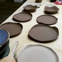 there are many plates on the table ready to be made