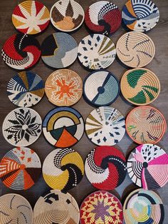 many colorful plates are arranged on the floor