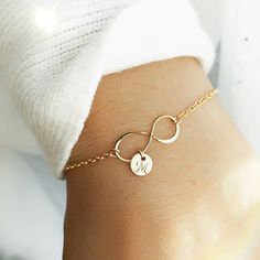 This infinity bracelet makes the perfect gift for a best friend or loved one.Show you mean forever with the infinity symbol, and customize it with their initial on a dainty disk. Item Details: • This listing is for ONE(1) Infinity bracelet.• Made in a 14K shiny gold plate over sterling silver and 925 sterling silver.• Infinity pendant - shiny finish, measures 19mm.• Tiny cute 6mm 22ga disk.• Letter style, Block font or Cursive font (default), upper case or lower case. Waterproof - We make those Gift For A Best Friend, Mothers Gifts, Gold Bracelet Simple, Latest Bracelets, Block Font, Medical Jewelry, Mothers Bracelet, Bracelet Initial, Star Charm Necklace