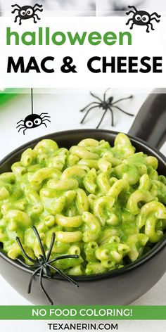 green macaroni and cheese in a black bowl with spider web on the side