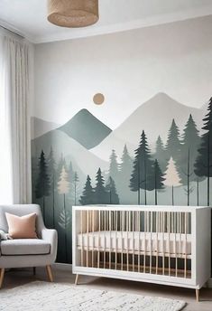 a baby's room with mountains and trees painted on the wall