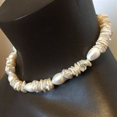 These are lovely and large keshi pearls, perfect for a wedding or a night on the town. Keshi pearls are completely natural pearls with no shell insert. They are solid nacre, and for that reason are particularly lustrous. The necklace is 17 inches long and is light and comfortable.. It would be a perfect bridesmaid gift, birthday or Christmas gift. Baroque Pearl Bracelet With Pendant For Wedding, High Luster Akoya Pearl Necklace For Wedding, Wedding Pearl Bracelet With Baroque Pearl Pendant, Wedding Pearl Bracelet With Baroque Pendant, Wedding Baroque Pearl Bracelet With Pearl Drop, Anniversary Pearl Drop Necklace In Mother Of Pearl, White High Luster Pearl Necklace, Akoya Pearl Necklace For Wedding With High Luster, Cream Pearl Pendant Necklace For Wedding