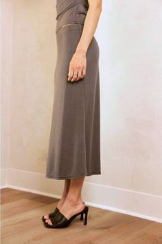 This fit-and-flare midi skirt is made from a soft, modal fabrication with a mid-rise, elasticated waist. Material 73% Modal, 27% Polyester Stretch Lined Maxi Skirt For Daywear, Chic Skirt With Elastic Waistband For Loungewear, Chic Loungewear Skirt With Elastic Waistband, Modest Stretch Midi Skirt, Casual Flowy Viscose Maxi Skirt, Flowy Midi Skirt For Loungewear, Flowy Long Skirt For Loungewear, Midi Skirt With Elastic Waistband For Loungewear, Stretch Maxi Skirt With Elastic Waistband For Daywear