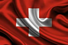 the flag of switzerland is flying in the wind with silky folds around it's edges