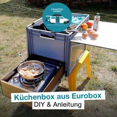 an outdoor table with food in it and the words kitchenbox aus eurobox diy & anleiting