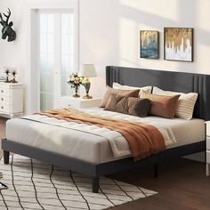 a bed room with a neatly made bed and two nightstands next to each other