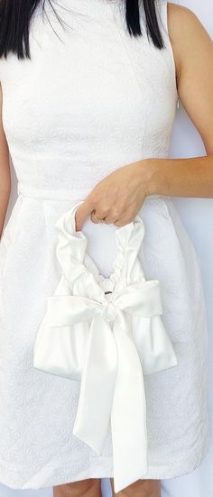 Satin White Bridal Bag, Bridal Purse Bag,Satin Small Elegant Bag, Evening Bag, White Color bag, Satin Evening Bag Gift,Bridesmaid Clutch bag I invite you to check out this charming handbag for women, which is made of exquisite satin (satin) and is designed to emphasize your unique beauty and elegance.  This handbag is ideal for those who value quality and style.  Features:  * Material: satin   * Fastener: metal button fastener  * Dimensions: width 27 cm / 10,5 inches, height 18 cm / 7 inches (with handles 27 cm/ 10,5 inches)  * Weight: 300 g  Description: This small handbag will be your faithful companion at any evening events, festive evenings, wedding ceremonies and cocktail parties.  It is made of high-quality satin, which gives it a shiny appearance and a delicate texture.  A metal but Wedding Evening Bag With Satin Lining, Rectangular Satin Wedding Bag, Chic Satin Bags With Satin Finish, Chic Satin Bag For Events, Satin Bags With Satin Finish For Events, Elegant Satin Pouch Bag, Formal Satin Pouch Bags, Chic Satin Clutch Bag, Snow White Wedding Dress