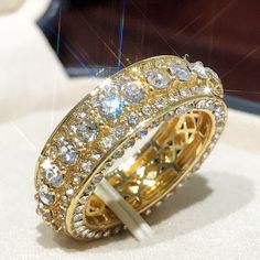 an elaborately designed ring is shown on display