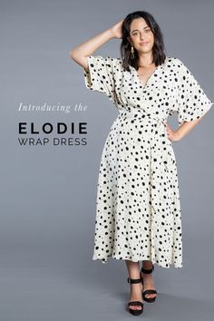 a woman wearing a white dress with black polka dots on it and the words, including the elodie wrap dress