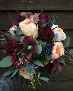 an arrangement of flowers is shown on a wooden background with words describing the different types of flowers