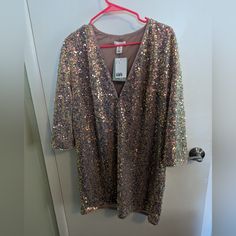 H&M Loose Fitting Sequin-Shirt Dress In Light Pink/Champagne Color. Size M H&m Mini Dress For Spring Party, H&m Long Sleeve Party Dress, H&m Cocktail Dresses For Party Season, H&m V-neck Mini Dress For Night Out, H&m Cocktail Dress For Party Season, H&m V-neck Party Dress, H&m V-neck Mini Dress For Party, Elegant H&m Dresses With Sequins, Elegant Sequined H&m Dresses