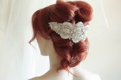 Vintage inspired beading gives a nostalgic picturesque look to every wedding attire. Each piece is carefully handcrafted using opulent swarovski stones and silk thread, making it a perfect heirloom head dress Colors : Ivory, offwhite and silverLength = 10 inchesMax width in the center is about 4 approximatelyFastening Options:1. Small comb on either side2. Ribbon - if you would like to wear this as a headband Shipping : Made to order, please allow 4 to 6 weeks to complete work Shop Policy : Due Silver Embellished Wedding Headpiece, Silver Embellished Headpiece For Wedding, Elegant Silver Beaded Headpiece, Elegant Embellished Crown Headpiece, Embellished Crown Headpiece For Weddings, Handmade Crown Headpiece For Wedding, Elegant Wedding Crown Headpiece, Elegant Embellished Bridal Accessories For Ceremony, Beaded Wedding Hair Accessories Headband