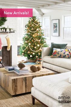 a living room with a christmas tree in the corner and presents on the coffee table