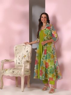 This Green Women Floral Printed Empire Kurta with Trousers is a versatile and stylish outfit. The kurta features a beautiful floral print, A-line shape, and empire style, creating a flattering silhouette. The trousers are solid and have a partially elasticated waistband for a comfortable fit. Made with silk blend machi Suits Design Latest, Western Kurtis, Printed Kurti Designs, Kurti Designs Latest, Kurti Design, Suits Design, Printed Kurti, Eid Collection, Empire Style