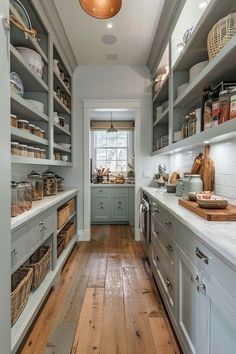 a kitchen filled with lots of open shelves