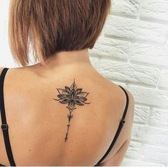 a woman with a tattoo on her back