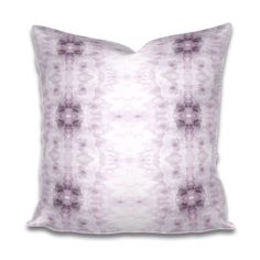 a purple and white pillow on a white background