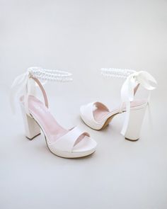 Chic Wedding Platform Block Heels, Chic Platform Block Heels For Wedding, Chic Platform Wedding Shoes, Platform Block Heels For Wedding In Spring, Bridal Shower Pearl Embellished Ankle Strap Sandals, Feminine Block Heel Wedding Sandals, Feminine Block Heel Sandals For Wedding, Elegant Wedding Block Heels With Platform, Wedding Platform Sandals With Block Heel