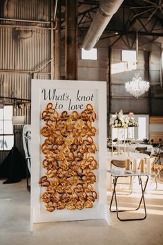 a sign that says whats knot to love with pretzels in the middle