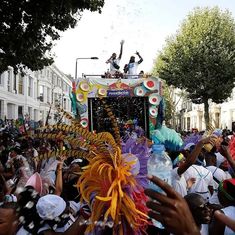 a group of people standing on top of a float