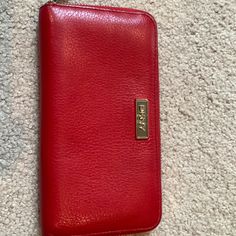 Nwot Red Zippered Wallet. Never Used. 8 Individual Credit Card Slots, One Interior Zipper Pouch, Two Large Slots For Cash, Receipts, Etc. Formal Red Wallet With Zipper Closure, Red Formal Wallet With Zipper Closure, Cheap Red Wallets With Zipper Closure, Red Wallet With Zipper Pouch, Red Wallet With Zipper Closure For Daily Use, Red Rectangular Wallet With Zipper Closure, Dkny Bag, Luxury Red Wallet With Zipper Closure, Leather Trifold Wallet