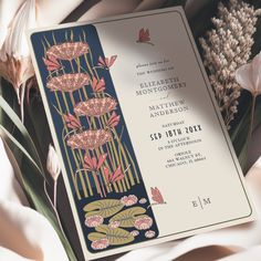 a wedding card with flowers on it