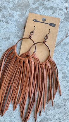 Brown Tassel Earrings For Festivals, Adjustable Brown Bohemian Tassel Earrings, Brown Fringe Tassel Earrings For Festivals, Artisan Brown Jewelry With Tassels, Brown Fringe Jewelry For Festivals, Bohemian Brown Fringe Earrings, Bohemian Brown Beaded Tassel Earrings, Brown Fringe Dangle Jewelry, Brown Fringe Tassel Dangle Earrings