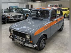 an orange and grey car parked in a garage