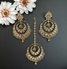 This Maangtikka and earring/jhumka set with beads in round shape comes in 2 beautiful colors, gray and Gold! The set is lightweight and has a beautiful finish with gold polki work and beads. perfect for light occasions or bridal wear, this set is handmade has a beautiful shine and statement shape. This lightweight and elegant set is perfect for any bridesmaid, bride, sangeet or any occasion or event as a gift for any occasion as any one who loves jewelry will love this statement piece. It has be Luxury Gold Plated Bridal Earrings With Meenakari, Eid Jewelry Sets With Chandbali Latkans, Eid Jewelry Sets With Latkans And Chandbali Shape, Gold Chandbali Jewelry Sets, Gold Bridal Sets With Chandbali Latkans, Gold Anarkali Jhumkas For Wedding, Hand-set Chandbali Earrings For Eid, Gold Hand-set Chandbali Jhumkas, Gold Jhumkas For Wedding