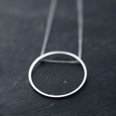 Singular rolling Oh silver necklace by Minicyn on Etsy Simple Round Everyday Necklace, Simple Everyday Round Necklace, Handmade Modern White Gold Necklaces, Modern Handmade White Gold Necklaces, Handmade Modern White Gold Necklace, Modern Handmade White Gold Necklace, Modern Everyday Necklace With Open Circle, Minimalist Full Circle Necklace With Delicate Chain, Minimalist Circle Necklace For Everyday