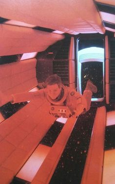 a man laying on top of a wooden bench next to a window in a building