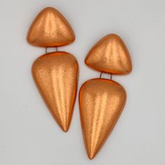 Silver Copper Earrings For Party, Orange Metal Earrings For Parties, Modern Copper Earrings As A Gift, Orange Metal Drop Earrings, Modern Orange Metal Jewelry, Orange Metal Earrings, Orange Metal Pierced Earrings, Orange Pierced Metal Earrings, Nickel-free Bronze Earrings For Party