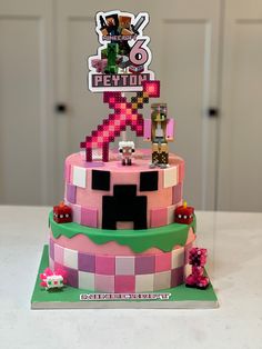 a cake made to look like an 8 - bit video game with the character pepitoi on top