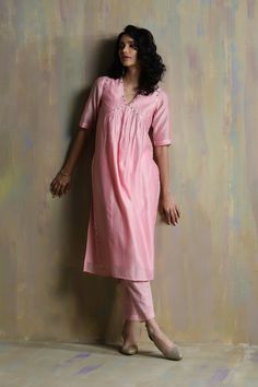 Editor's Note Chanderi Kurta With Colored Embroidery, Embedded With Mirrors On the Yoke And Side Slits. This Kurta Is Paired With Straight Pants & Chanderi Dupatta Embellished With Mirror Work. Fabric: Kurta: Chanderi Lining: Cotton Pant: Cotton Dupatta: Chanderi Narrow Dupatta: Organza Color: Pink Care: Dry Clean Only About the Designer A brand that seeks inspiration in the classics while honouring minimalistic opulence. Charkhee is a label that brings to you a beautiful medley of noteworthy cr Pastel Mirror, Pastel Pants, Chanderi Dupatta, Sustainable Clothing Brands, Kurta With Pants, Mirror Work, Kurta Set, Pant Set, Sustainable Clothing