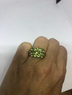 Rich and very bright Peridot green ring Sterling silver with gold rhodium finish Size 8 can be sized by my jeweler. His service charge is $10 All rings are shipped in a nice gift box. Check out our over a THOUSAND great reviews Engraving is $4 per letter and is not always perfect depending on the piece. It can take a few days if the jeweler is busy. This is payable to Paypal Judithsltd@gmail.com Green Crystal Ring For Anniversary, May Birthstone, Green Round Crystal Ring In Fine Jewelry Style, Green Round Crystal Ring Fine Jewelry, Green Crystal Round Ring Fine Jewelry, Green Peridot Rings For Anniversary, Green Crystal Ring Gift Hallmarked, Unique Green Crystal Promise Ring, Green Peridot Crystal Ring With Gemstone, Unique Green Peridot Rings