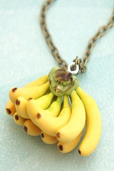 a bunch of bananas sitting on top of a chain