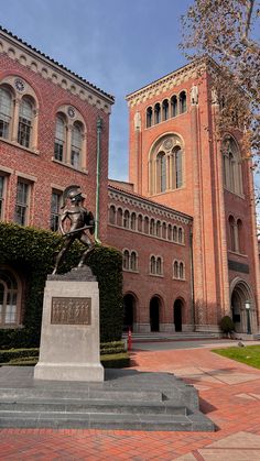 a statue is in front of a building