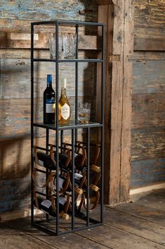 a wine rack with several bottles and glasses