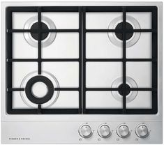 a white stove top with four burners and knobs