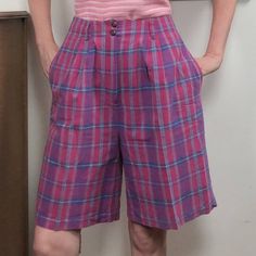 "Vintage Plaid Bermuda Shorts by L.L. Bean, 1980s High Waist Cotton Shorts in Pink & Purple Plaid, Size Medium 100% cotton shorts in fuchsia, amethyst, with hints of blue and chartreuse. These high waisted shorts are about knee length and have a wide and full leg. The waistband is tailored and has belt loops, with two buttons at the waist band and a zipper closure. Generous on-seam pockets at each hip. These shorts are in excellent condition and have no issues - no rips, stains, or other condition problems. Preppy, academia type of style, classic L.L. Bean. These are marked size 12, but measure more like a modern size medium or 8. For best fit, please compare the measurements below to your own, or to the size chart of a brand that fits you well. Waist: 29\" Hips: 46\" Waist to hem: 22\" In Blue And Chartreuse, Bermuda Shorts Outfit, Preppy Academia, Purple Plaid, Vintage Plaid, Plaid Shorts, Clothing Care, Pink Plaid, Style Classic