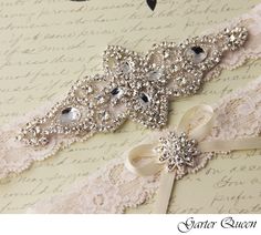 two wedding garters are laying on top of an old paper with writing in the background