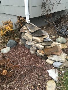 a pile of rocks sitting next to a house